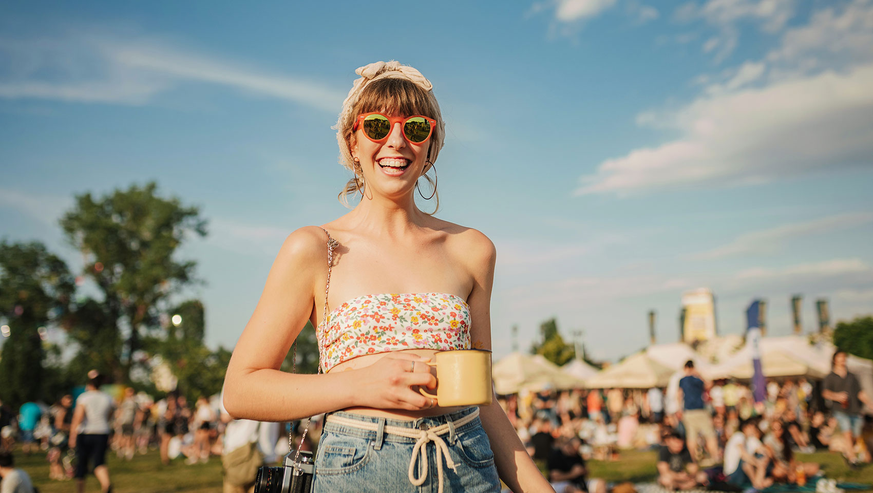 Girl holding mug at a festival